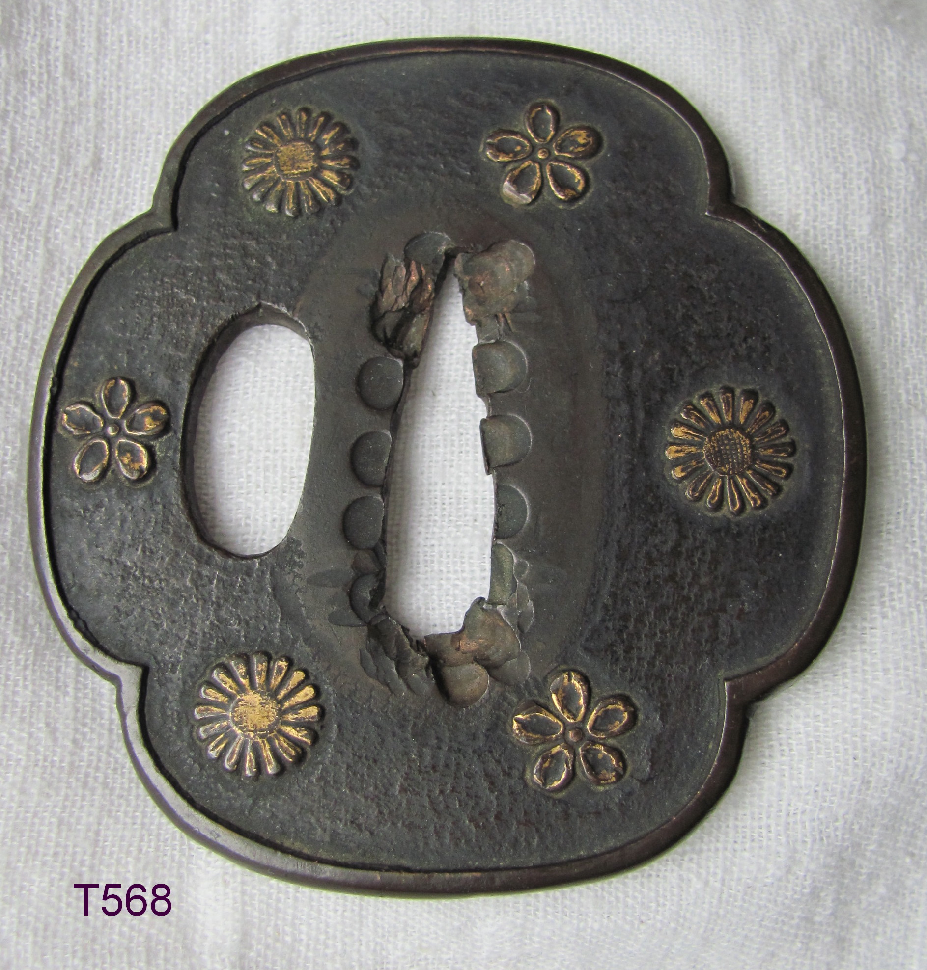 T568. Kinko Tsuba with Brass Flowers